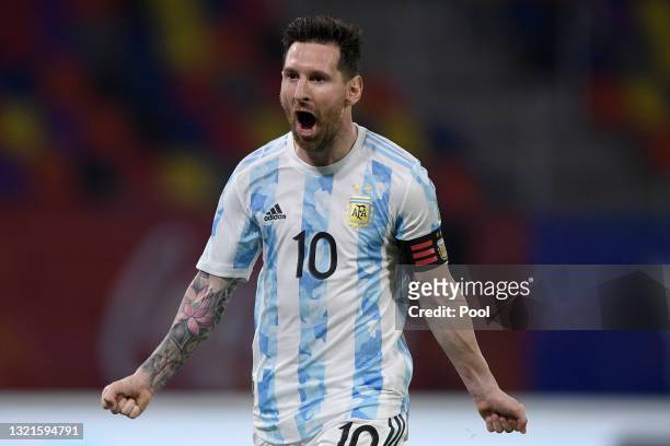 Lionel Messi of Argentina celebrates after scoring the opening goal of his team with a penalty kick during a match between Argentina and Chile as...