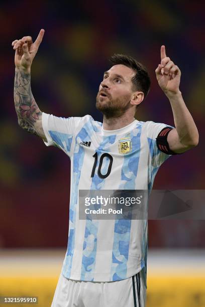 Lionel Messi of Argentina celebrates after scoring the opening goal of his team with a penalty kick during a match between Argentina and Chile as...