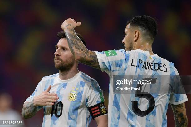 Lionel Messi of Argentina celebrates with Leandro Paredes after scoring the opening goal of his team with a penalty kick during a match between...