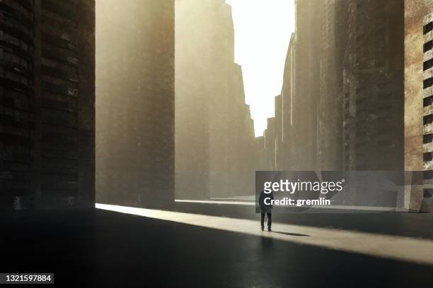lonely sad businessman in futuristic city - office building exterior small stock pictures, royalty-free photos & images