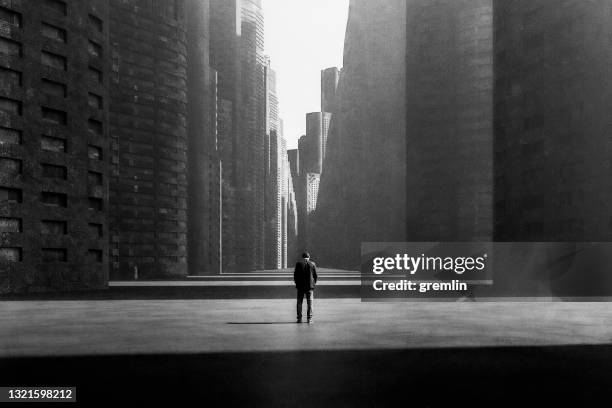 lonely sad businessman in futuristic city - office building exterior small stock pictures, royalty-free photos & images