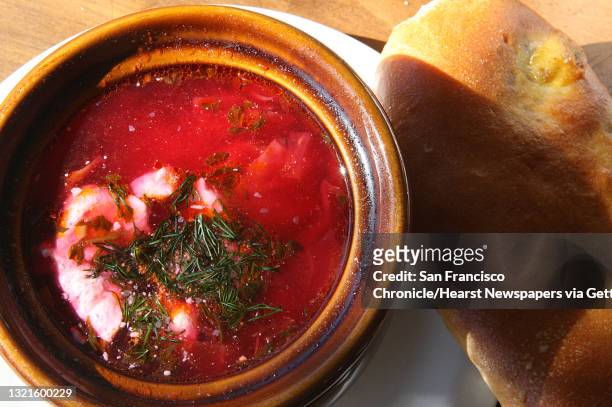 Borsch soup--chopped vegetables, shredded cabbage, cubed potatoes, and beets in a tomato broth served hot with sour cream--and a baked beef and...
