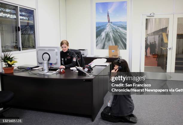 Oracle team and family relocation and support liason Melissa Holmes and Oracle staff member Julie Sutherland working at the front office of the 2013...