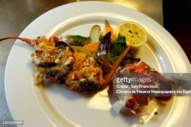 Lobster Thermidor--fresh half maine lobster baked with brandy lobster veloute, poached lobster tail warm fingerling potato and carrot salad--served...