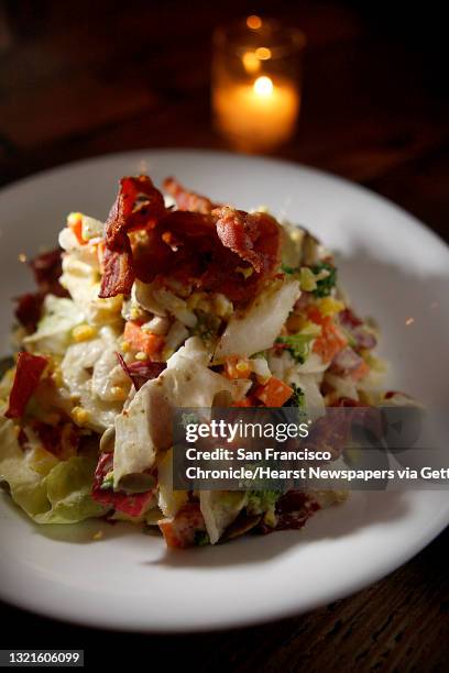 Seasonal chopped salad--radish, broccoli, fontina, crispy pancetta, radicchio, pumpkin seed, hardboiled egg, and red wine vinaigrette--spicy tomato,...