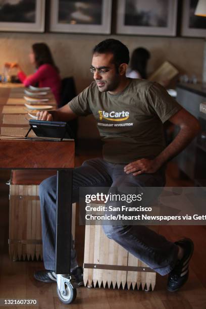 And founder Rajat Suri of E la Carte, a new tablet that restaurants can put at every table for do-it-yourself ordering and paying the bill, using the...