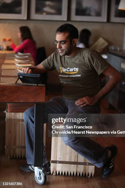 And founder Rajat Suri of E la Carte, a new tablet that restaurants can put at every table for do-it-yourself ordering and paying the bill, using the...