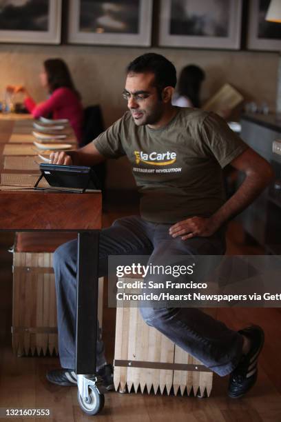 And founder Rajat Suri of E la Carte, a new tablet that restaurants can put at every table for do-it-yourself ordering and paying the bill, using the...