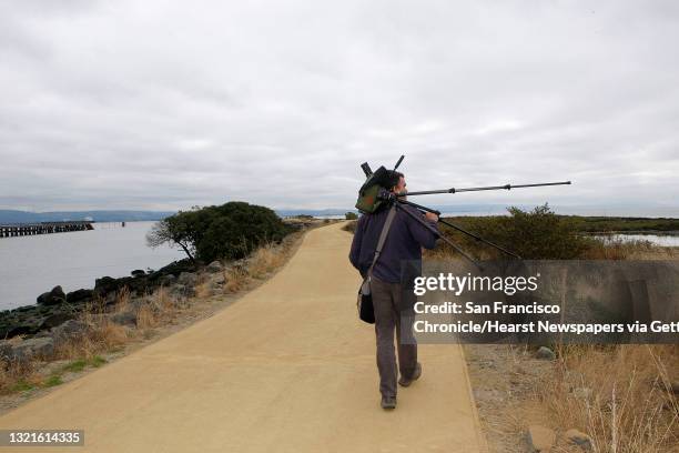 Naturalist John Muir Laws with his telescope at Heron's Head Park in San Francisco, Calif.,looking for birds to draw on Wednesday, July 18, 2012.