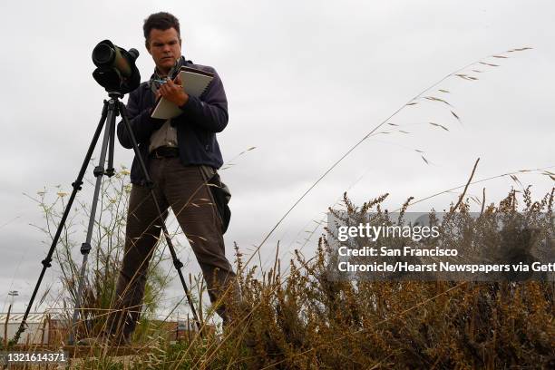 Naturalist John Muir Laws with his telescope at Heron's Head Park in San Francisco, Calif., as he draws in his sketchbook on Wednesday, July 18, 2012.