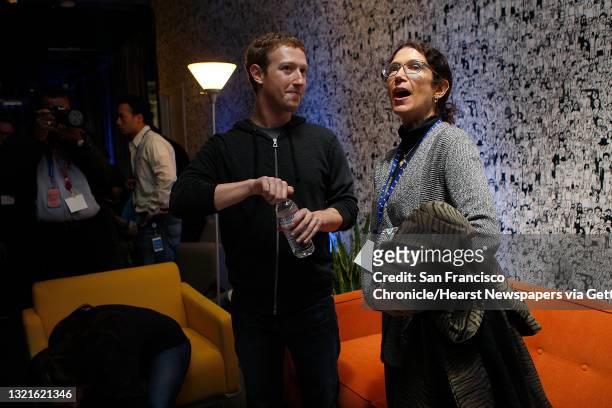 Chairman and chief executive Mark Zuckerberg talks with his mother Karen Zuckerberg after he introduced Facebook Home on Android at Facebook...