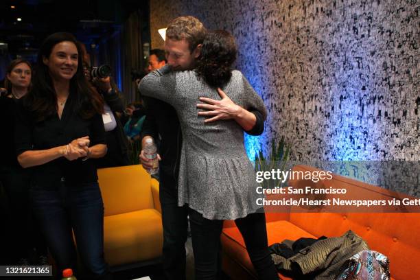 Chairman and chief executive Mark Zuckerberg gets hug from his mother Karen Zuckerberg after he introduced Facebook Home on Android at the Facebook...