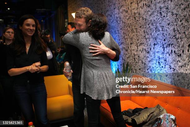 Chairman and chief executive Mark Zuckerberg gets hug from his mother Karen Zuckerberg after he introduced Facebook Home on Android at the Facebook...