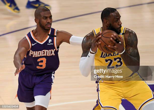 LeBron James of the Los Angeles Lakers is fouled by Chris Paul of the Phoenix Suns as he spins in the second quarter during game six of the Western...