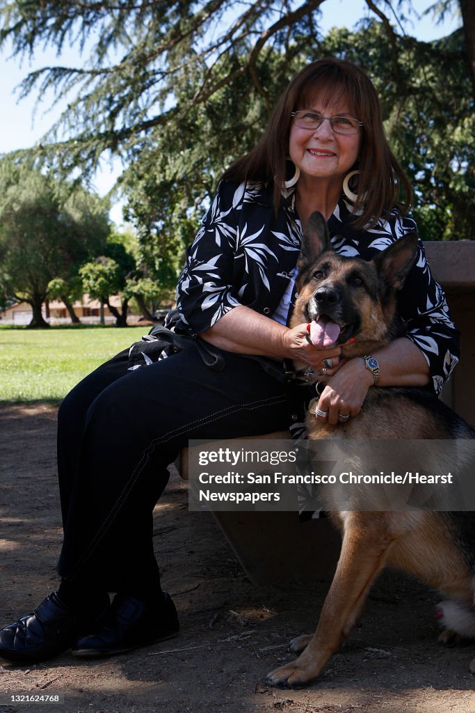 President Joan Cannelli of Golden State German Shepherd Rescue with four year old german shepherd Drake at Cowell Community Parkin Concord, Calif., on Monday, June 17, 2013. Joan had trigeminal neuralgia, a form of facial nerve pain, for about 5 years f