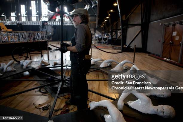Artist Peter Hudson works on 'Sisyphish' at the Armory in San Francisco, Calif., in preparation for the New Years Eve party on Monday, December 30,...