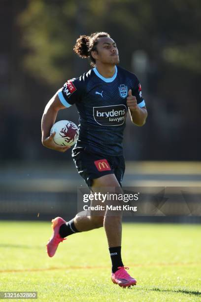 Jarome Luai runs with the ball during a New South Wales Blues State of Origin training session at Redfern Oval on June 04, 2021 in Sydney, Australia.