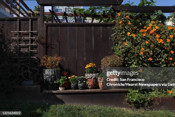 Cheryl Olinger has planters with faces displayed in her garden in San Francisco, Calif., on Tuesday, September 11, 2012. Her husband Michael Olinger...