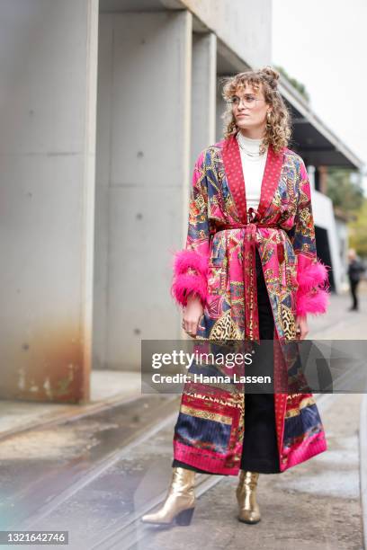 Courtney Green wearing Camilla robe and vintage boots at Afterpay Australian Fashion Week 2021 on June 04, 2021 in Sydney, Australia.