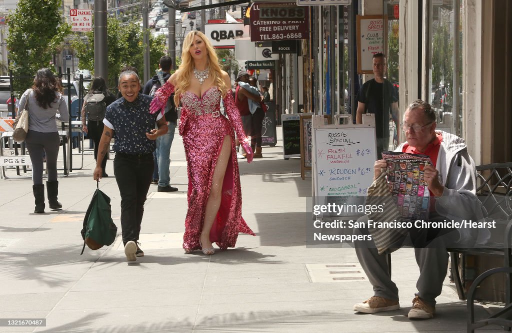 Artist and activist Mason J (middle left) and burlesque performer Cassandra Cass (middle right) talk about Caitlyn (Bruce) Jenner in San Francisco, California, on Tuesday, June 2, 2015. Charles Rogers (far right) checks out the Castro cinema lineup.