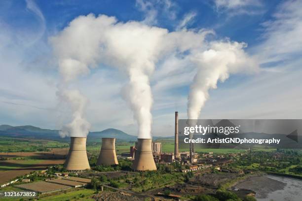 industrial factory with smoke in the sky, environmental issue. - emitting stock pictures, royalty-free photos & images