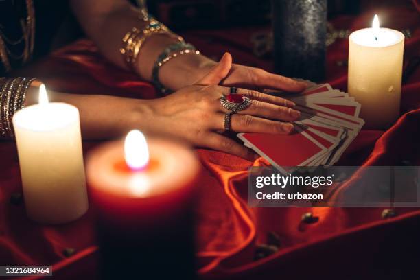 fortune teller reading tarot - tarot cards stock pictures, royalty-free photos & images