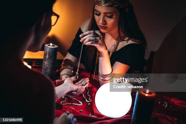 fortune teller reading from palm - palmistry hand stock pictures, royalty-free photos & images