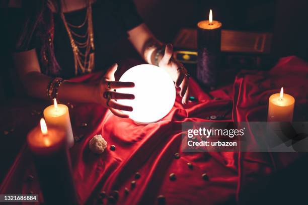 fortune teller and crystal sphere - fortune teller stock pictures, royalty-free photos & images