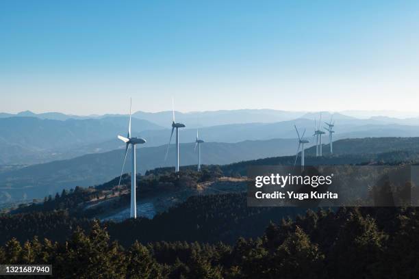 wind turbines on a hill - wind power station stock pictures, royalty-free photos & images