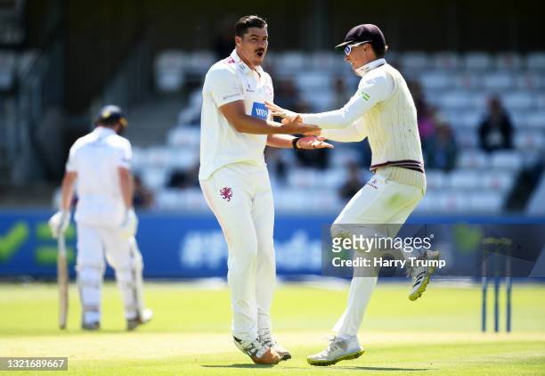 Marchant De Lange of Somerset celebrates after taking the wicket of Tom Alsop of Hampshire with team mate Tom Banton during Day Two of the LV=...