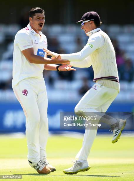 Marchant De Lange of Somerset celebrates after taking the wicket of Tom Alsop of Hampshire with team mate Tom Banton during Day Two of the LV=...
