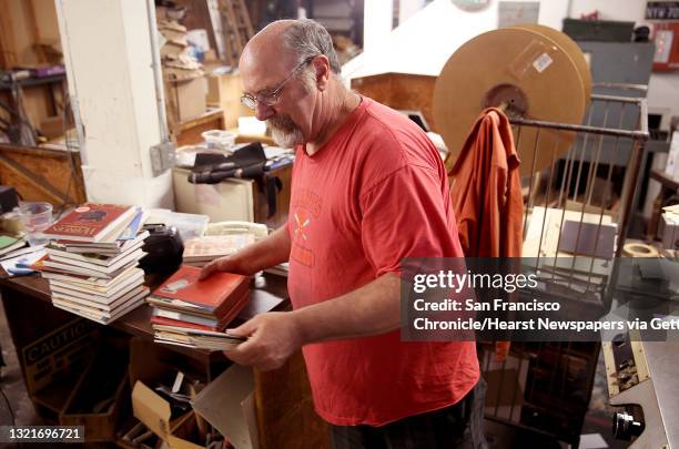 Building and business owner Doug MacNeil of Spiral Binding, works on Monday, August 1 in San Francisco, Calif. His ankle was spiked with a used...