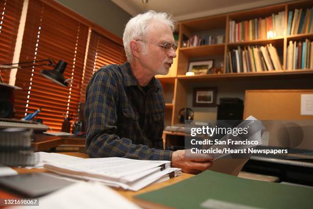 Berkeley composer John Adams reads a letter in a current opera he is composing in his office at home on Tuesday, November 22 in Berkeley, Calif.