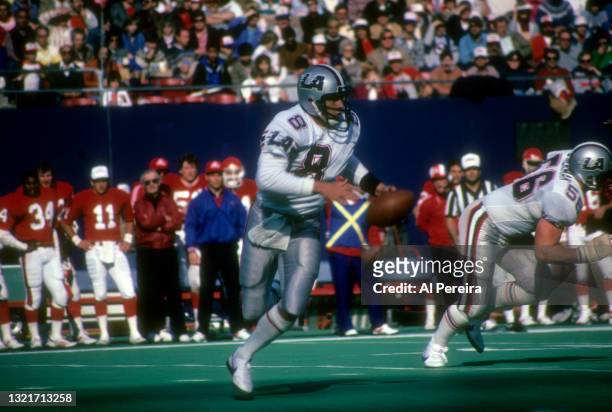 Quarterback Steve Young of the Los Angeles Express rolls out in the game between the Los Angeles Express vs The New Jersey Generals of the United...
