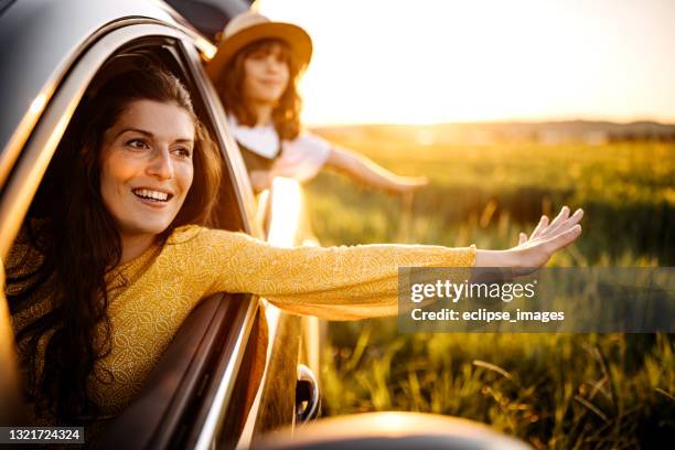 traveling to the middle of nowhere - happy family in car stock pictures, royalty-free photos & images