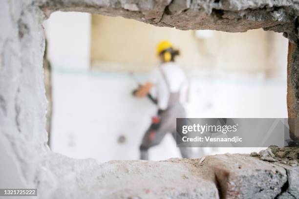 worker using hammer drill - pulling down mask stock pictures, royalty-free photos & images