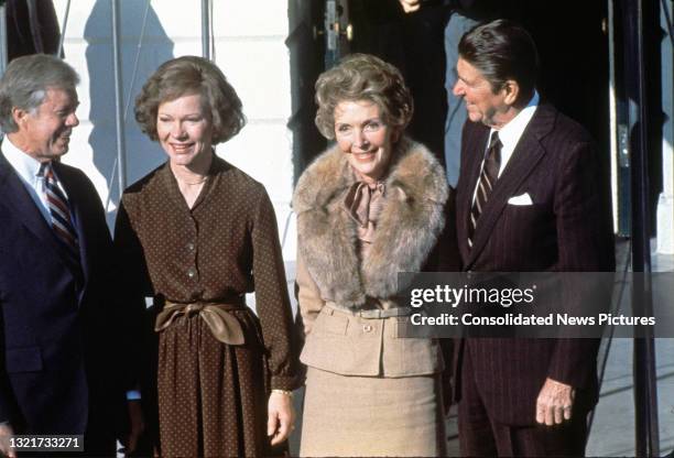 Portrait of, from left, US President Jimmy Carter, US First Lady Rosalynn Carter, Nancy Reagan , and President-elect Ronald Reagan as they pose on...