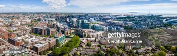 panoramic aerial view of dublin city skyline on a sunny day - dublin aerial stock pictures, royalty-free photos & images