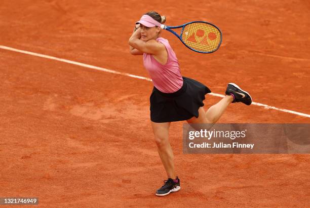 Ana Bogdan of Romania plays a backhand during her Women's Singles third round match against Paula Badosa of Spain on day six of the 2021 French Open...