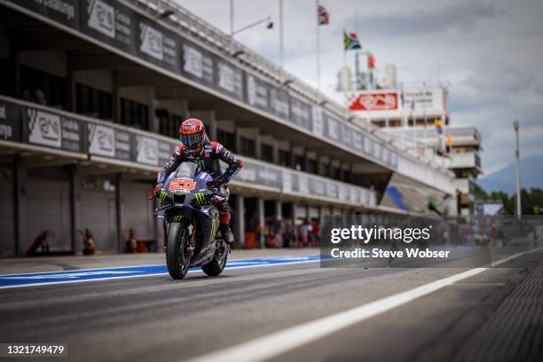 Fabio Quartararo of France and Monster Energy Yamaha MotoGP rolls through the pitlane to start his session during the MotoGP Gran Premi Monster...