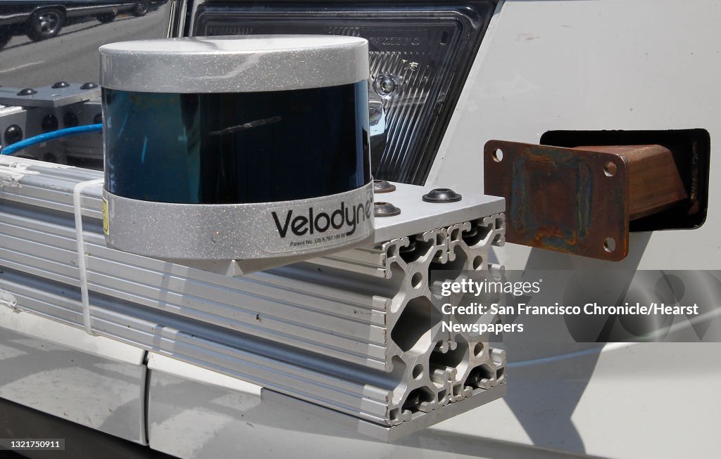 A lidar, cylindrical device with motion detection radar for 3d point cloud views of nearby objects, attached to the front of an Otto truck on Tuesday, August 23, 2016, in San Francisco, Calif.