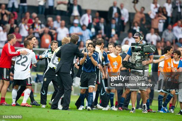 Roberto Ayala of Argentina is gesturing to Oliver Bierhoff the general manager of the German team at the end of the penalties during the World Cup...