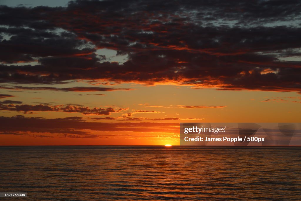 Scenic view of sea against dramatic sky during sunset,Glenelg South,South Australia,Australia