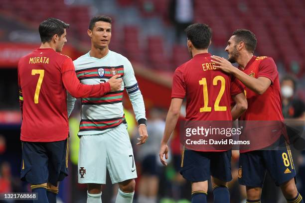 Alvaro Morata, Eric Garcia and Koke of Spain embrace Cristiano Ronaldo of Portugal at the end of the international friendly match between Spain and...