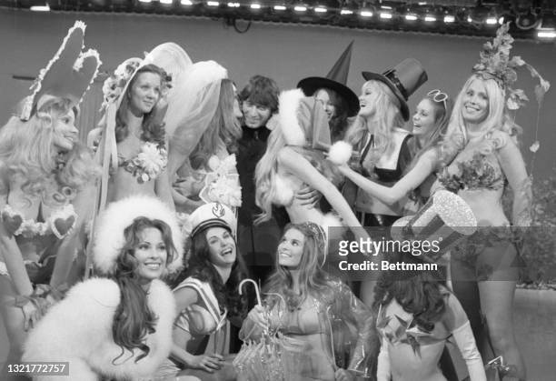 If you look closely you can see Joe Namath, of the New York Jets, in the center of twelve Playboy Playmates. Namath and the women appeared on the...