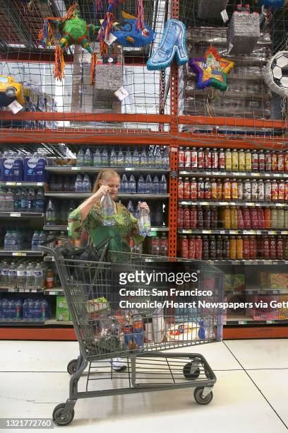 Linda Tollefson shops at Winco market after her ride from home with a Lyft driver on Tuesday, May 8, 2018 in Pittsburg, Calif. Tri Delta Transit...