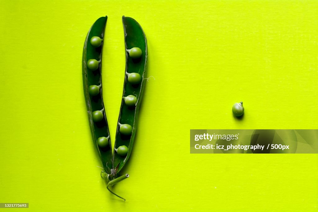 Directly above shot of green peas on green background,Italy