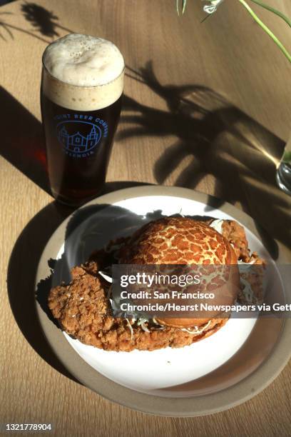 Pork Chop Bun?Black Pepper Sauce, Ginger Scallion Mayo, Cabbage & Onions?paired with Westfalia beer seen on Tuesday, Oct. 1 in San Francisco, Calif....