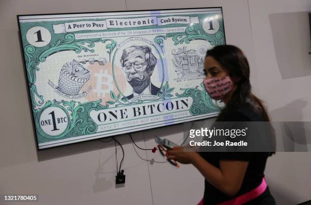 Art piece titled BTC Bank Note by artist Gus GG hangs at the Bitcoin 2021 Convention, a crypto-currency conference held at the Mana Convention Center...
