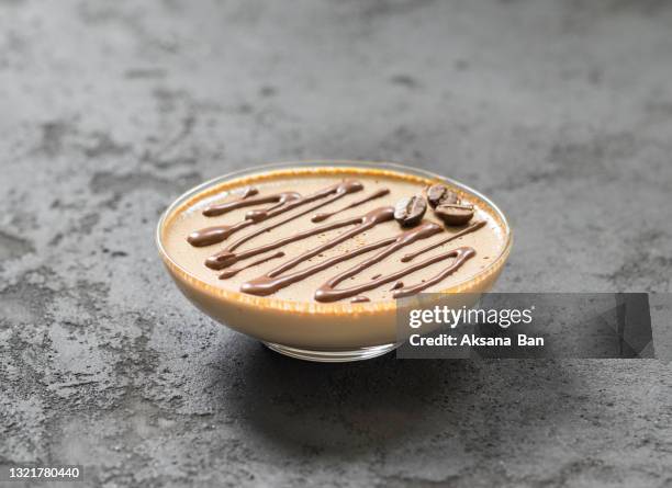 cream coffee dessert, jelly, panna cotta with chocolate in glass on a dark gray background - dark chocolate mousse stock pictures, royalty-free photos & images